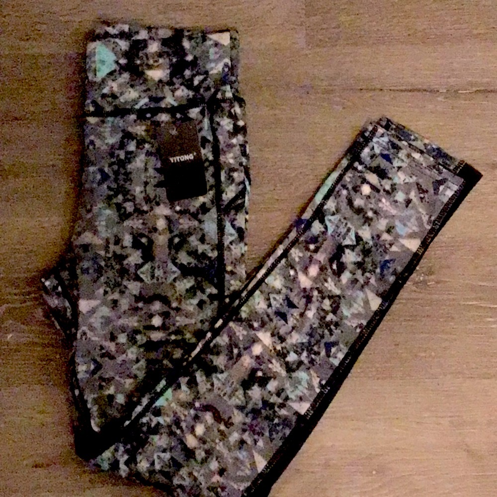 L/XL Camouflage Leggings with black mesh near the knee.NWT